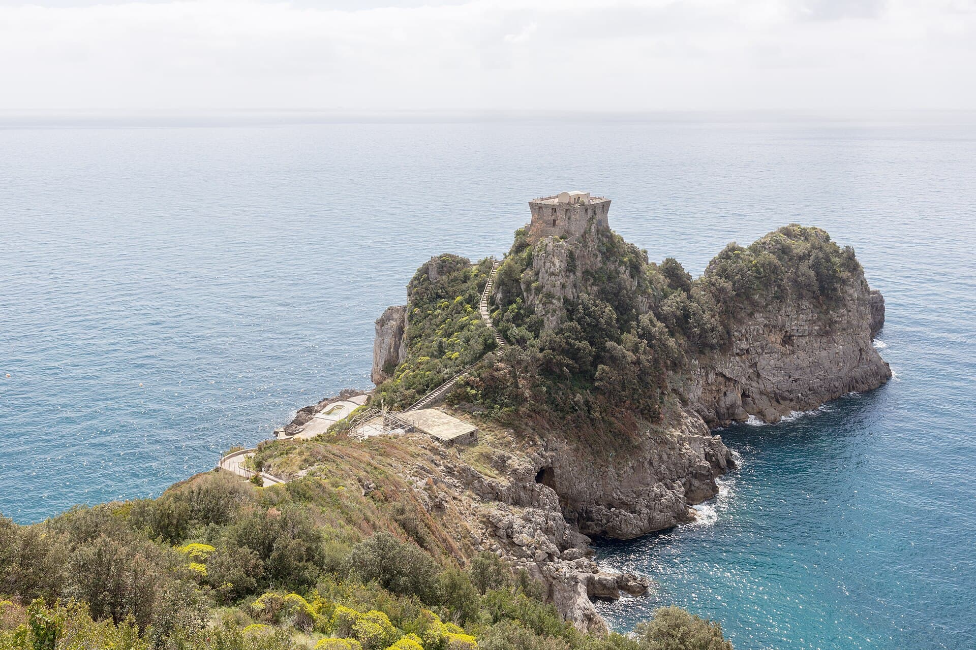 Watchtower on the cape of Conca dei Marini above a pale sea