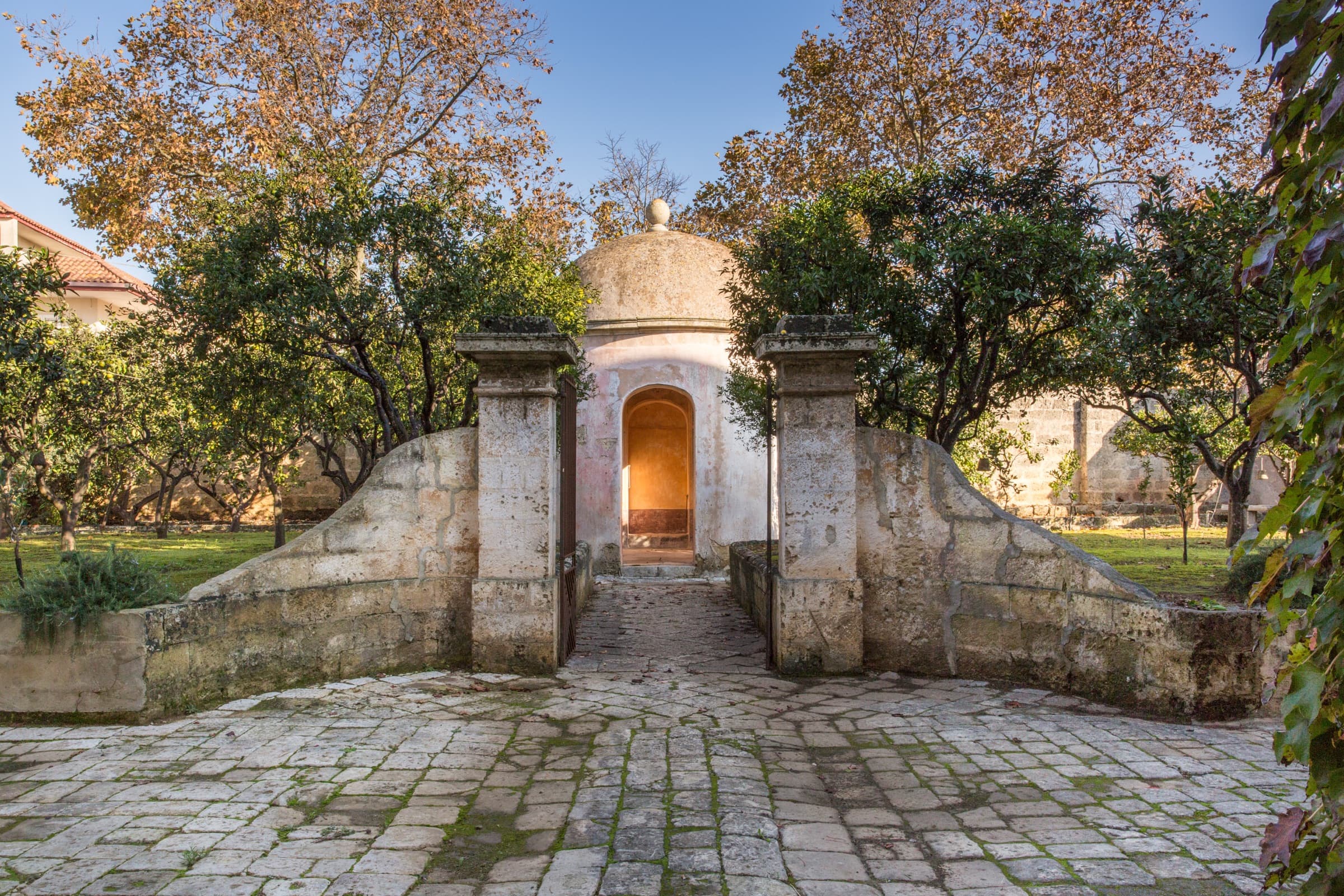 Stone gate to the palazzo garden at dusk